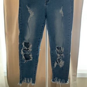 Light blue distressed jeans with frayed bottom